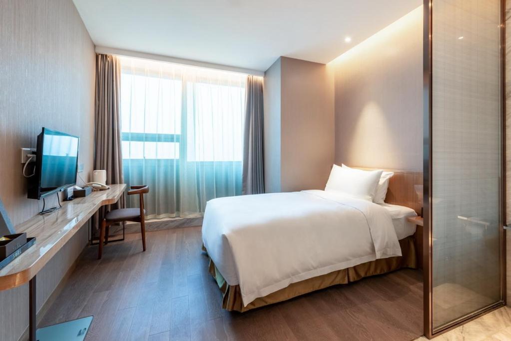 Auto City Ruili Hotel Jiading Екстер'єр фото